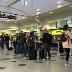 Dollar Car Rental - People waiting in line to be told there is a 2 hr waiting list for your reservation to be ready.