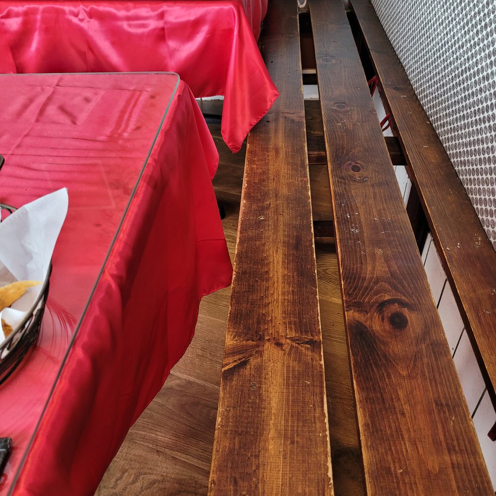 Rocio's Mexican Kitchen - The planks of this wooden bench are uncomfortably spaced apart. - Mexican Near Me - Bell Gardens, California Rocio's Mexican Kitchen - The planks of this wooden bench are uncomfortably spaced apart. - Mexican Near Me - Bell Gardens, California