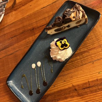 Square Root - a slice of cheesecake on a plate - American Near Me - Brevard, North Carolina