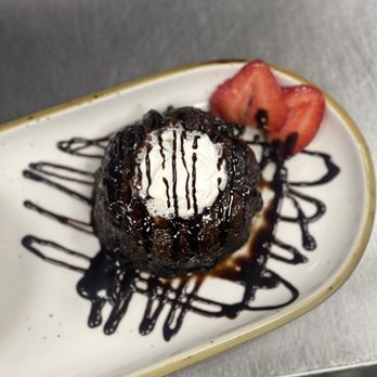 Legends Steakhouse - Dessert : Malt Chocolate Lava Cake served with vanilla ice cream! 10/10 recommend!! - Steakhouses Near Me - Murphy, North Carolina