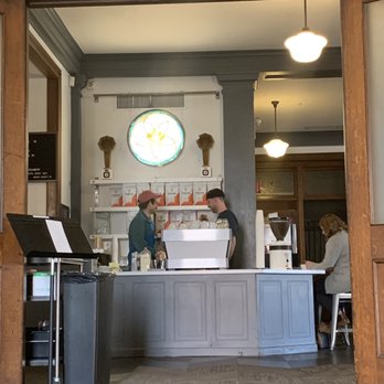 Coat Check Coffee - This was the entrance into the main area of the coffee shop. Those were the two baristas working the counter. - Coffee & Tea Near Me - Indianapolis, Indiana