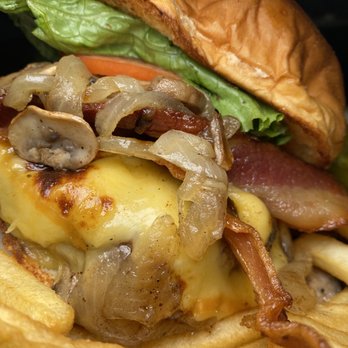 Karvers Grille - The Dutch Man Burger- beef burger topped with smoked gouda cheese, sauteed mushrooms, carmalized onions, pecan bacon - American Near Me - Holbrook, New York Karvers Grille - The Dutch Man Burger- beef burger topped with smoked gouda cheese, sauteed mushrooms, carmalized onions, pecan bacon - American Near Me - Holbrook, New York