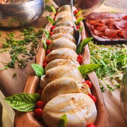 Dino's Greek Food truck - We offer catering here is a burrata plate for a wedding.