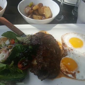 Surfish Bistro - Skirt steak and eggs with some left over ceviche. This dish comes with potatoes. - Latin American Near Me - Brooklyn, New York Surfish Bistro - Skirt steak and eggs with some left over ceviche. This dish comes with potatoes. - Latin American Near Me - Brooklyn, New York