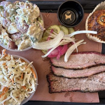 Pit Fiend Barbecue - The whole meal we split (1/2 lbs brisket, jalapeño cheddar cornbread, coleslaw and potato salad). - Barbeque Near Me - Denver, Colorado Pit Fiend Barbecue - The whole meal we split (1/2 lbs brisket, jalapeño cheddar cornbread, coleslaw and potato salad). - Barbeque Near Me - Denver, Colorado