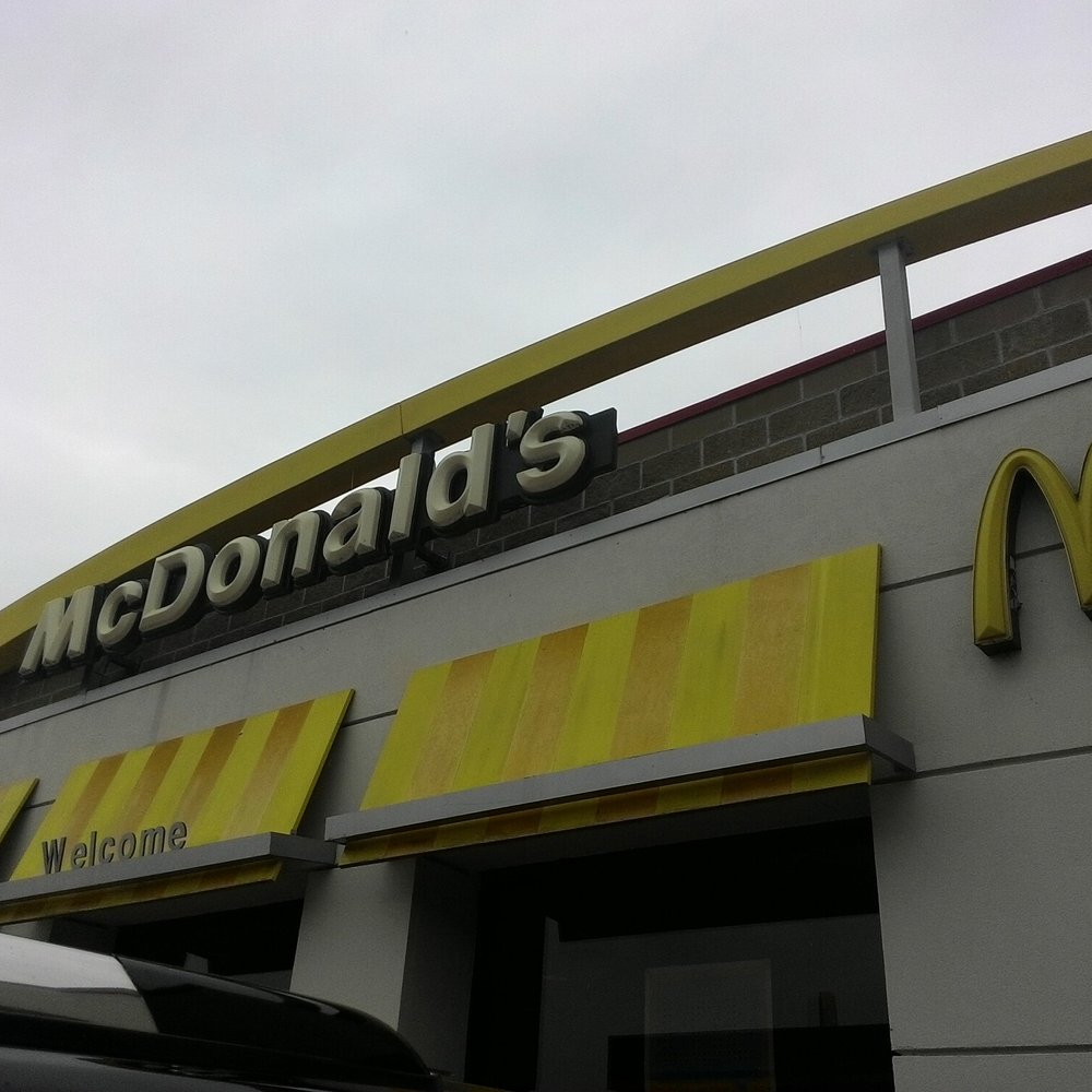 the front of a mcdonald's restaurant the front of a mcdonald's restaurant