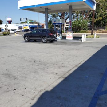 Chevron - a black car parked in front of a gas station - Gas Stations Near Me - Tarzana, California