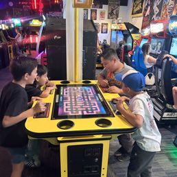 Kids having a blast playing Pac-Man
