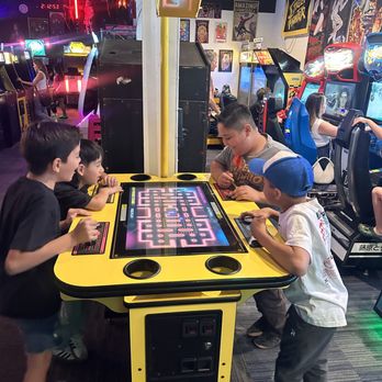 Revival Arcade - Kids having a blast playing Pac-Man - Arcades Near Me - San Bernardino, California