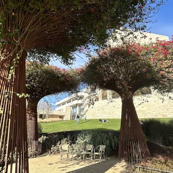 The Getty Center - Seating is everywhere, even under these funny Dr Seuss trees! Lol - Art Museums Near Me - Los Angeles, California