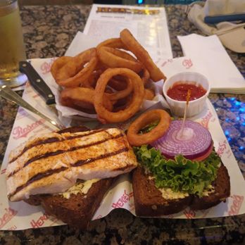 Heroes Bar & Grill - Mahi sandwich on squaw bread with yummy onion rings. And Pear cider. - New American Near Me - Fullerton, California Heroes Bar & Grill - Mahi sandwich on squaw bread with yummy onion rings. And Pear cider. - New American Near Me - Fullerton, California