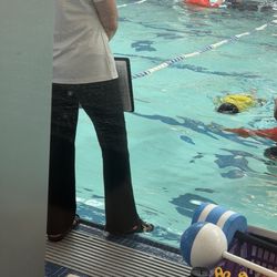 Soaking her shoes into the pool