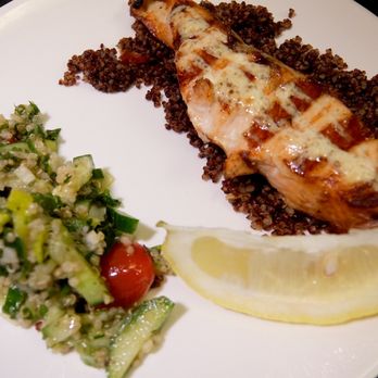 Cypriana - Tender, Juicy salmon on a bed of red quinoa and garnished with a tabouli salad. - Mediterranean Near Me - Baltimore, Maryland