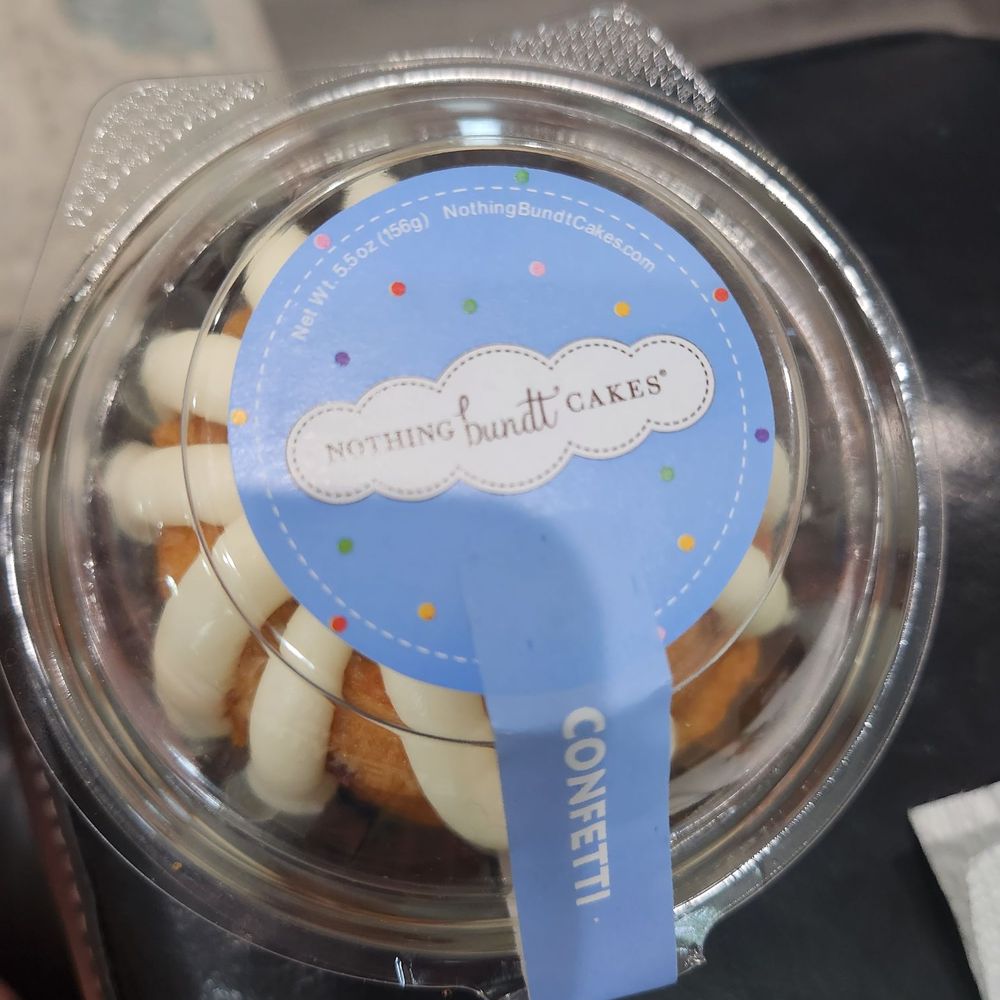 a cupcake in a plastic container a cupcake in a plastic container