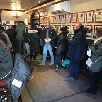 Peter Luger - Waiting area next to bar. Long lines so be sure to make your reservations early. If not, you'll wait an hour or more. - Steakhouses Near Me - Brooklyn, New York Peter Luger - Waiting area next to bar. Long lines so be sure to make your reservations early. If not, you'll wait an hour or more. - Steakhouses Near Me - Brooklyn, New York
