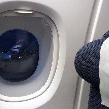 British Airways - From the seat and while dark, you can make out some British tails nearby or at adjacent gates. - Airlines Near Me - West Drayton, XGL