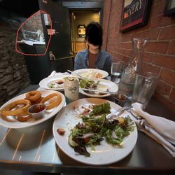Two Brothers Tavern - Our table after being finished eating for 25 minutes.  The red circle to the left is the ledge with 3" deep pigeon guano.