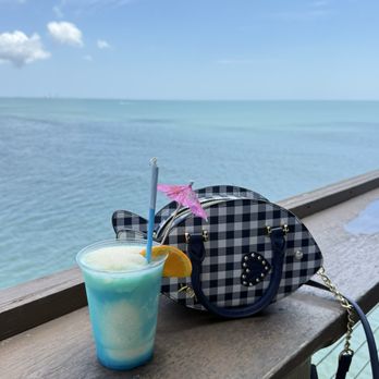 Rikki Tiki Tavern - Delicious piña colada drink with the beautiful dining views - Tiki Bars Near Me - Cocoa Beach, Florida