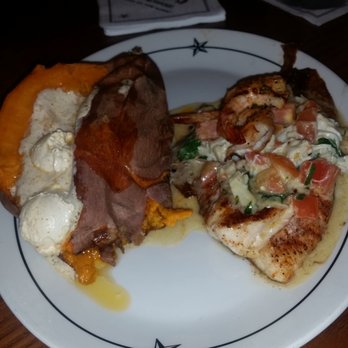 Saltgrass Steak House - Blackened Redfish Shrimp, lump crabmeat, spinach, diced tomatoes, scallions, lemon butter. Sloppy plating but it was good. - Steakhouses Near Me - Lafayette, Louisiana