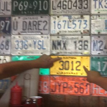 River City Cafe - Fun decor - license plates from around the world! We are pointing to Eleuthera in the Bahamas, this is where we honeymooned!!! - American Near Me - Murrells Inlet, South Carolina