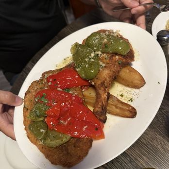 Tipsters Village Pub - Pork chop Milanese Garlic, oil, white wine and roasted peppers & potatoes!! Ridiculously good!! - Pubs Near Me - North Riverside, Illinois