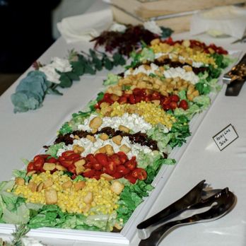 The Yard A Mobile Eatery - a long platter of food - Caterers Near Me