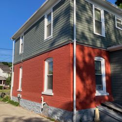 D Robinsons Goods and Services - Dustin painted the upper portion of the house.