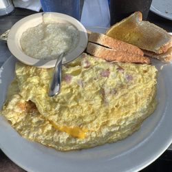 Ham and cheese inlet with toast and grits