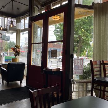 Madrona Hill Cafe - Entrance with plush club chair and greenery - Bakeries Near Me - Portland, Oregon