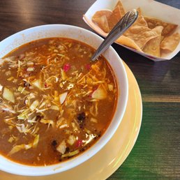 Pozole and complimentary chips and salsa Pozole and complimentary chips and salsa