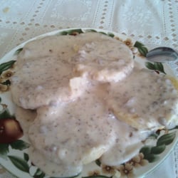 All Seasons Cafe - A plate of homemade creamy goodness topping two light biscuits.  All Seasons Cafe, Aberdeen, Idaho