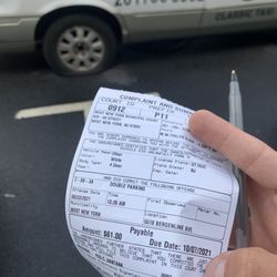 West New York Parking Authority - Here is the proof, ticket in my hand and my flat tire in the background. Key, ALWAYS TAKE PICTURES OR RECORD.