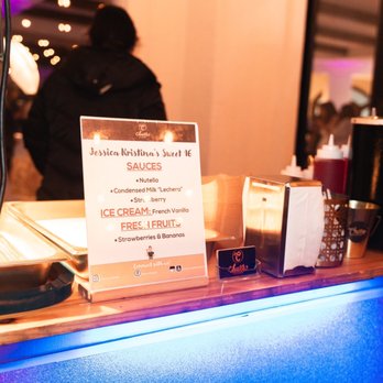 Churro Champ Events - a sign on a counter - Caterers Near Me