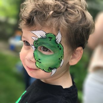 Kaleidoscope Painters - A dinosaur coming out of his shell. - Face Painting Near Me Kaleidoscope Painters - A dinosaur coming out of his shell. - Face Painting Near Me