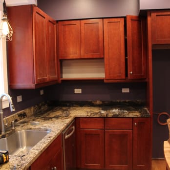 Skor Construction - a kitchen with wood cabinets and granite countertops - General Contractors Near Me - Palatine, Illinois Skor Construction - a kitchen with wood cabinets and granite countertops - General Contractors Near Me - Palatine, Illinois