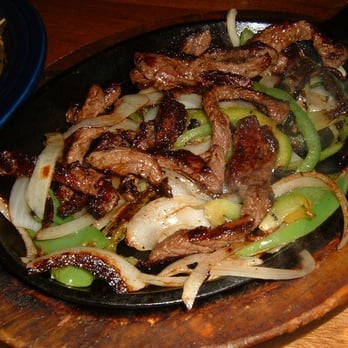 Mi Cocina Mexican Restaurant - a plate of beef and onions - Mexican Near Me - Littleton, Colorado Mi Cocina Mexican Restaurant - a plate of beef and onions - Mexican Near Me - Littleton, Colorado