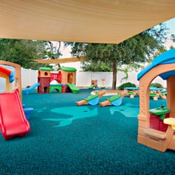 Island Prep - We offer two large shaded playgrounds covered in recycled rubber and water misting fans to cool the playground.
