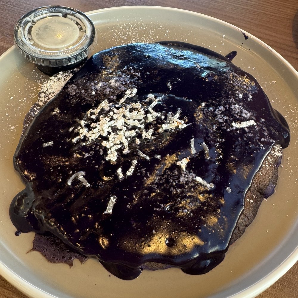 Scramblers Cafe - Ube Coconut Pancakes - Coconut Sauce served on side - Breakfast & Brunch Near Me - Ontario, California Scramblers Cafe - Ube Coconut Pancakes - Coconut Sauce served on side - Breakfast & Brunch Near Me - Ontario, California