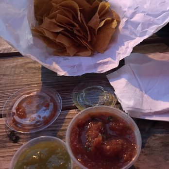 Nacho Taco - Chips, pico (bottom right), green tomatillo salsa (bottom left) - Food Stands Near Me - Jacksonville, Florida Nacho Taco - Chips, pico (bottom right), green tomatillo salsa (bottom left) - Food Stands Near Me - Jacksonville, Florida