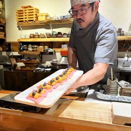 Gino presenting uni topped toro