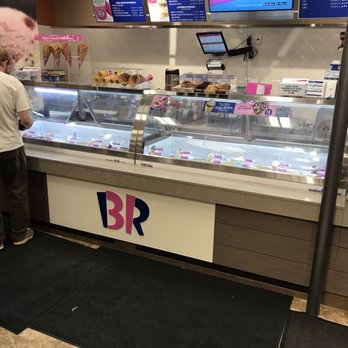 Baskin Robbins - a man standing in front of a display case - Ice Cream & Frozen Yogurt Near Me - Eagan, Minnesota