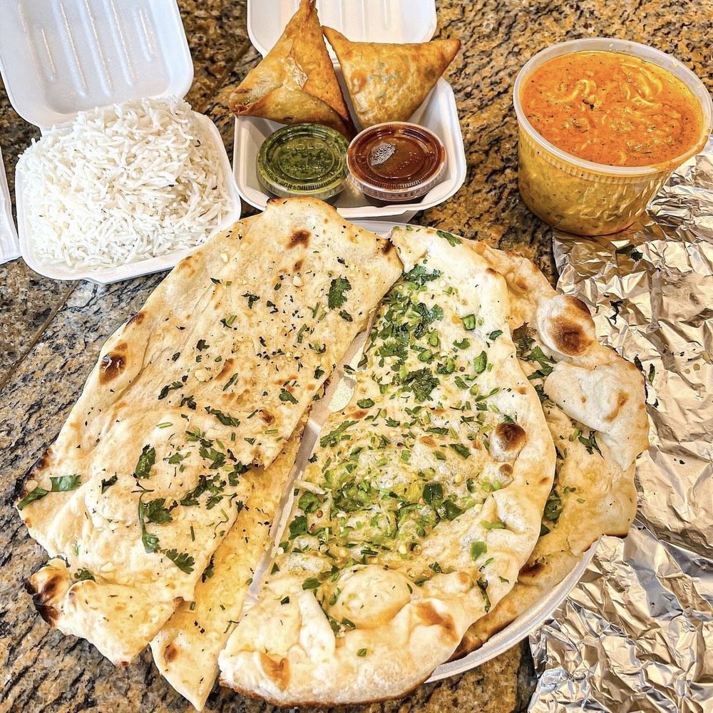Masala Cottage - Garlic Naan, Chicken Makhani (Butter Chicken), Chicken Samosas (2), Steamed Basmati Rice - Indian Near Me - McDonough, Georgia Masala Cottage - Garlic Naan, Chicken Makhani (Butter Chicken), Chicken Samosas (2), Steamed Basmati Rice - Indian Near Me - McDonough, Georgia