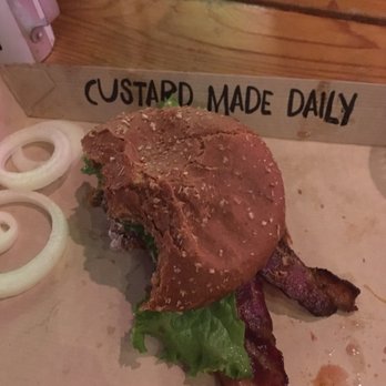 Twisted Root Burger - Spicy goat with a few bites taken out - Burgers Near Me - Waco, Texas Twisted Root Burger - Spicy goat with a few bites taken out - Burgers Near Me - Waco, Texas