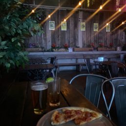a slice of pizza on a plate on a table