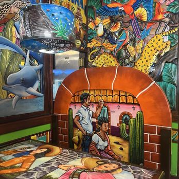 Riviera Maya - hand carved and painted walls, seating, tables, chairs & light fixtures - Mexican Near Me - Dunnellon, Florida Riviera Maya - hand carved and painted walls, seating, tables, chairs & light fixtures - Mexican Near Me - Dunnellon, Florida