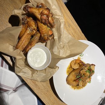 Edgar's Proof & Provision - a plate of chicken wings and dipping sauce - New American Near Me - Atlanta, Georgia