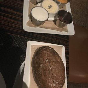 Photo of BLT Steak - Las Vegas, NV, United States. Baked potato and topping plate