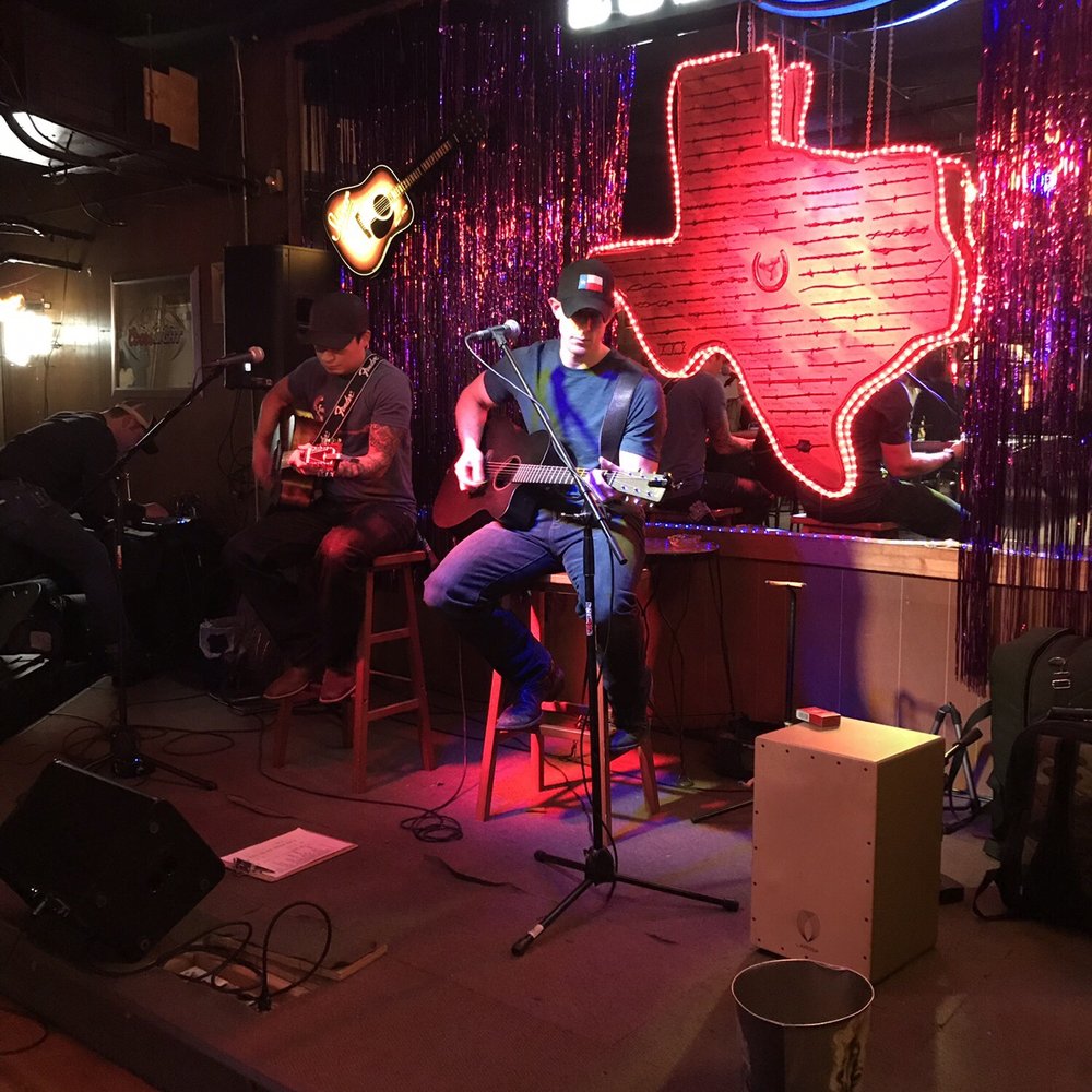 Cowboy Club - a man sitting on a stool playing guitar - Bars Near Me - Van Alstyne, Texas Cowboy Club - a man sitting on a stool playing guitar - Bars Near Me - Van Alstyne, Texas