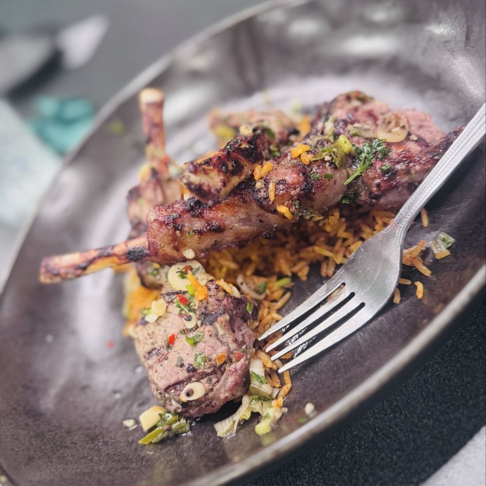 Allure Lounge - Lamp chops with Jollof rice - Restaurants Near Me - Orlando, Florida Allure Lounge - Lamp chops with Jollof rice - Restaurants Near Me - Orlando, Florida
