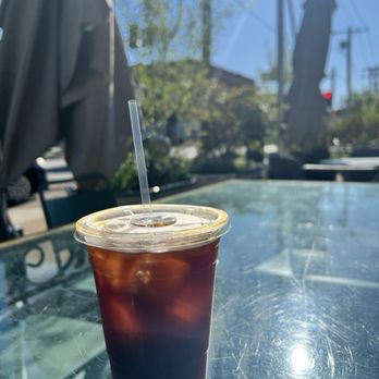 AO&Co. Market & Cafe - Outside with a cold brew on a warm morning - Coffee & Tea Near Me - St. Louis, Missouri
